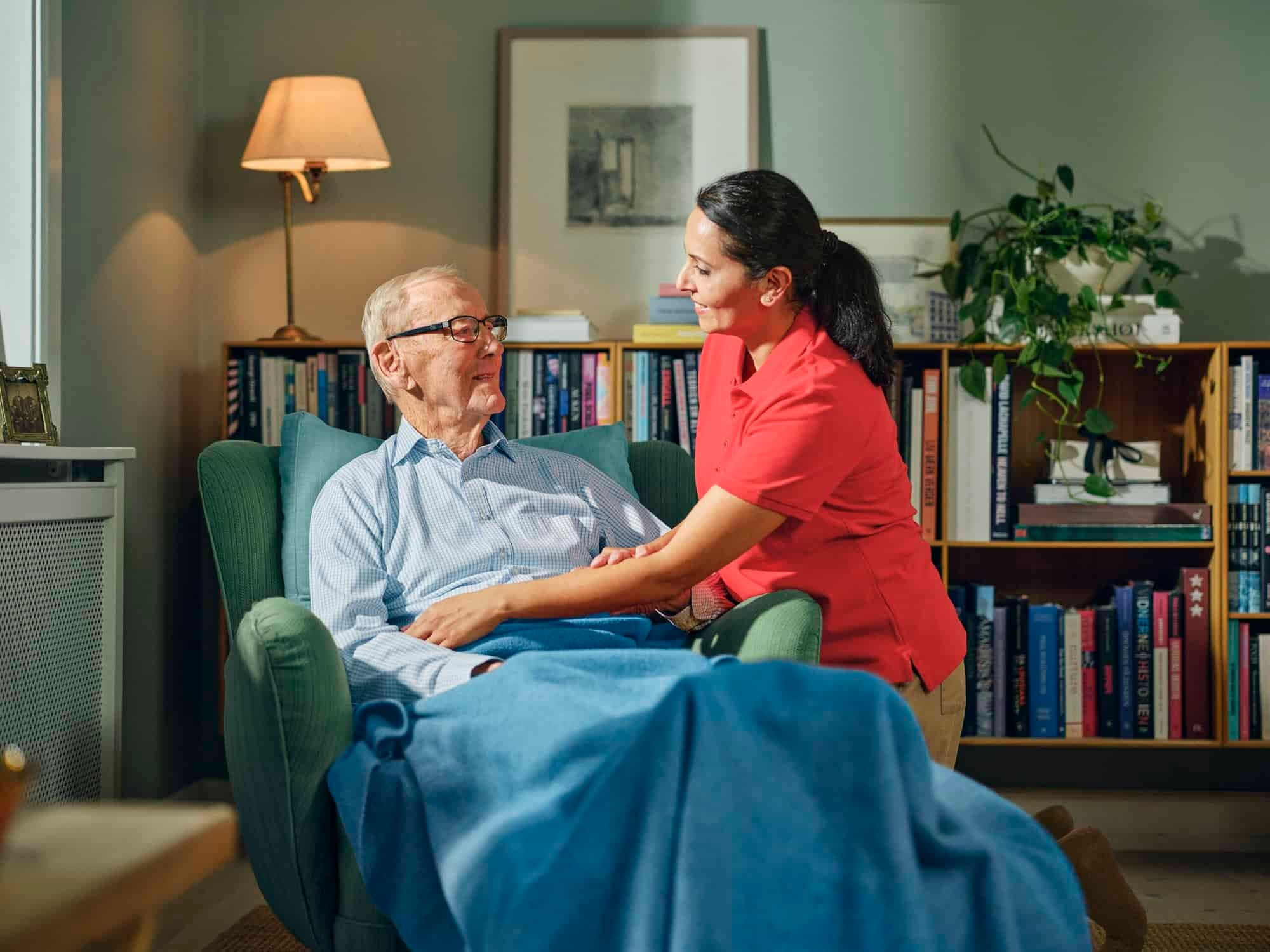 A Dovida caregiver with a client at home